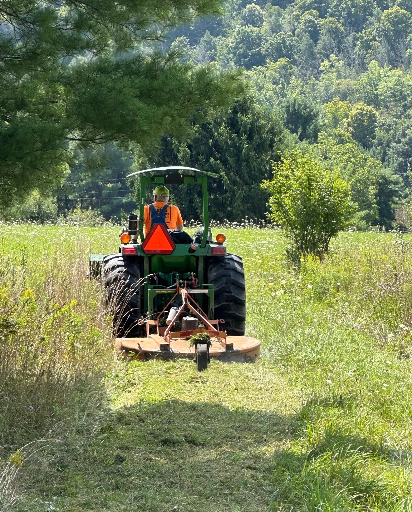 Excavator grading soil at a residential construction site in Galeton, PA for a new foundation